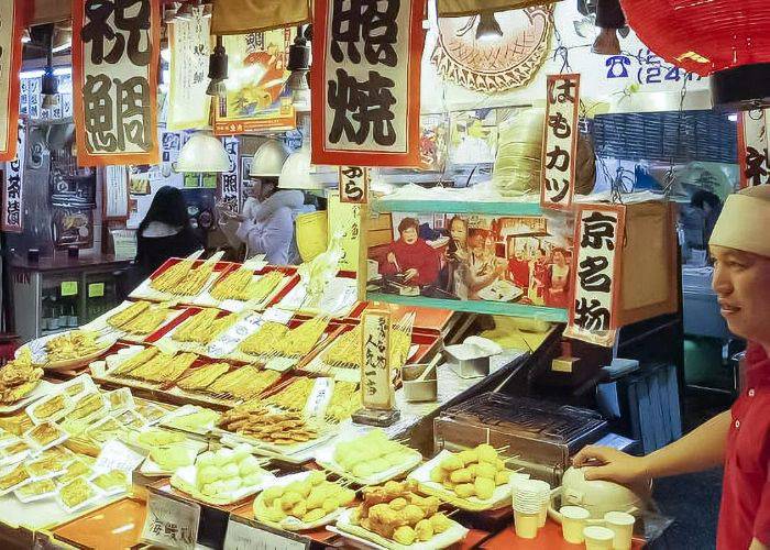A Nishiki Market food stall, filled with all kinds of skewered street foods.